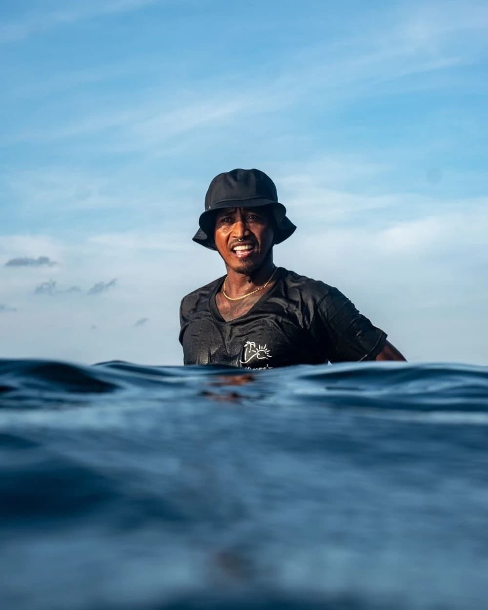 Allan Derecho, founder and head coach of SPF Surfcoaching, in the water at Siargao